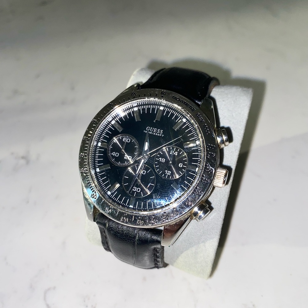 Men’s silver face black leather watch